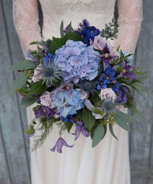 RUSTIC-BRIDAL-with-hydrangea-thistle-rose-clematis