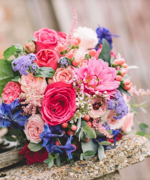 vibrant pink blue bridal bouquet